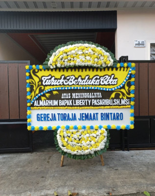 Papan Bunga Duka di Lolong Belanti